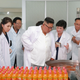 Kim Jong Un and his wife, Ri Sol Ju, (left) visit the Songdowon General Foodstuff Factory.